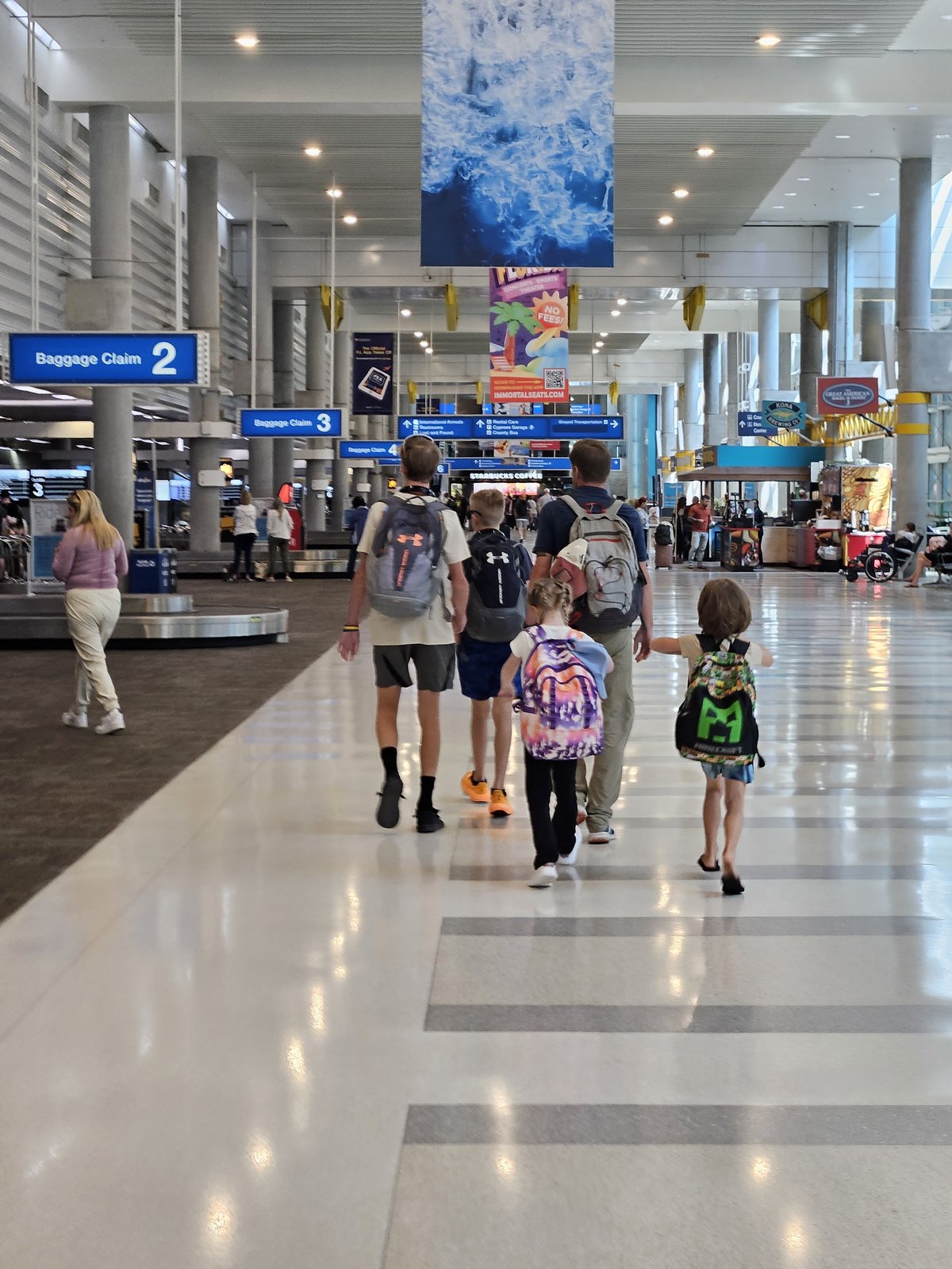 The crew walking through the airport, ready for the next trip