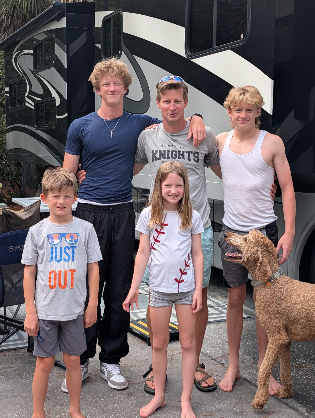 The Newman kids and Andrew together with the family dog at Disney's Fort Wilderness