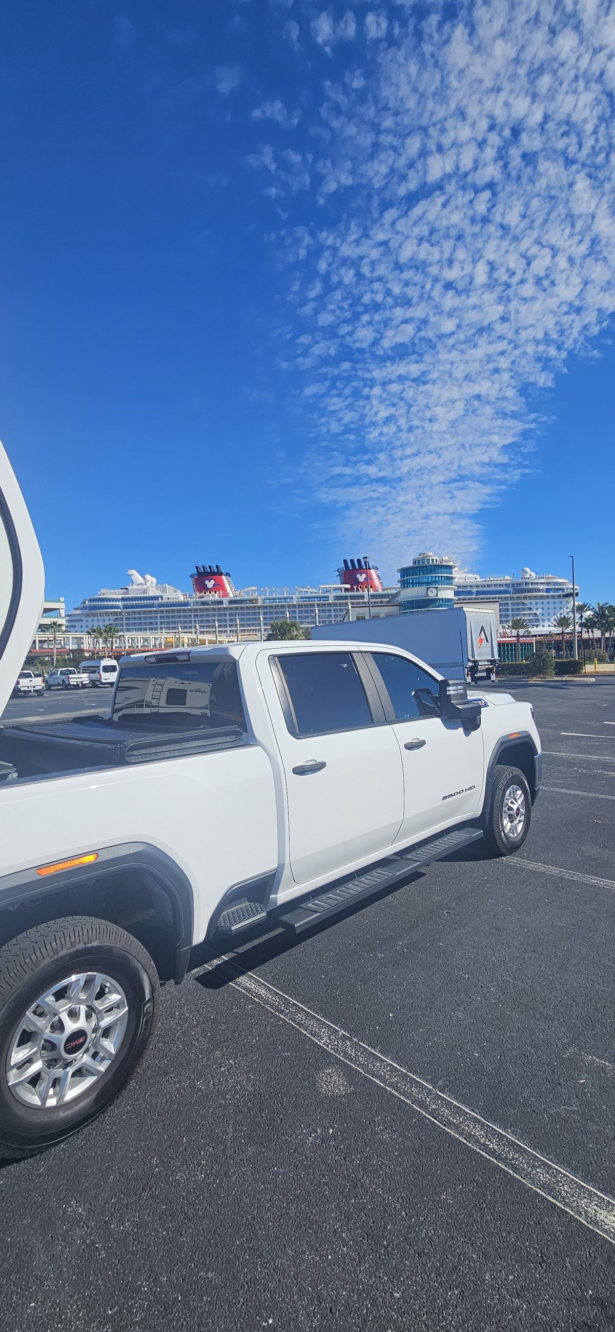 Pulling into Port Canaveral with a Disney ship in view